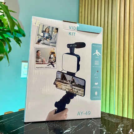 Kit completo para creadores Micrófono + trípode + luz + control Bluetooth - Elegance Colombia